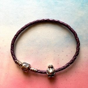 Pandora leather bracelet with penguin charm.